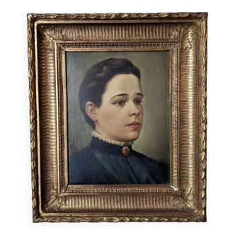 Oil on canvas portrait in an antique gilded wooden frame.
