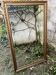 Large antique mirror with bevelled glass bordered by a row of pearls 148 x 88