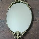 Antique mirror, oval with brass crest