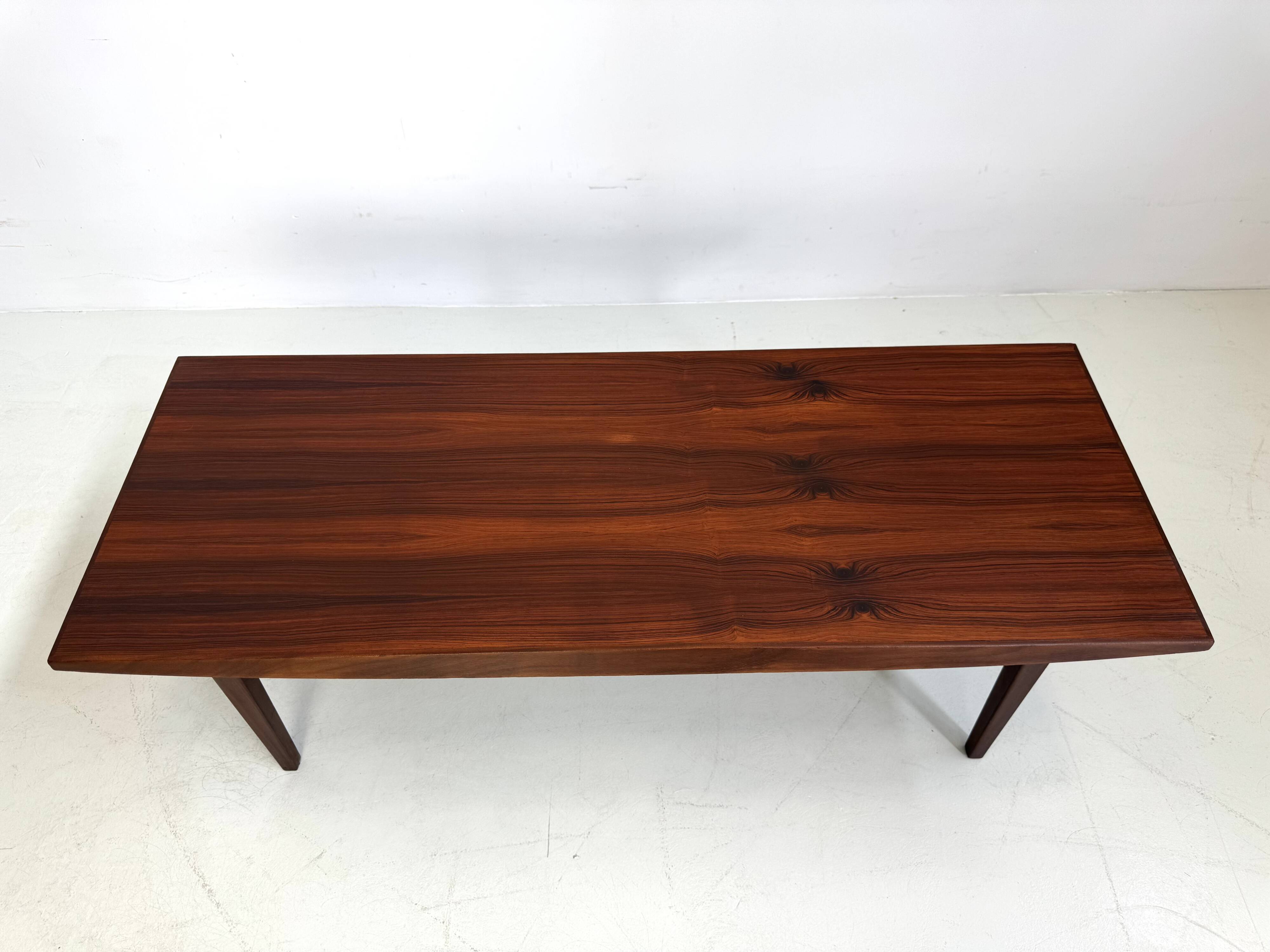 Beautiful compact design coffee table made of rosewood from the 1960s.