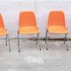 Orange plastic chairs