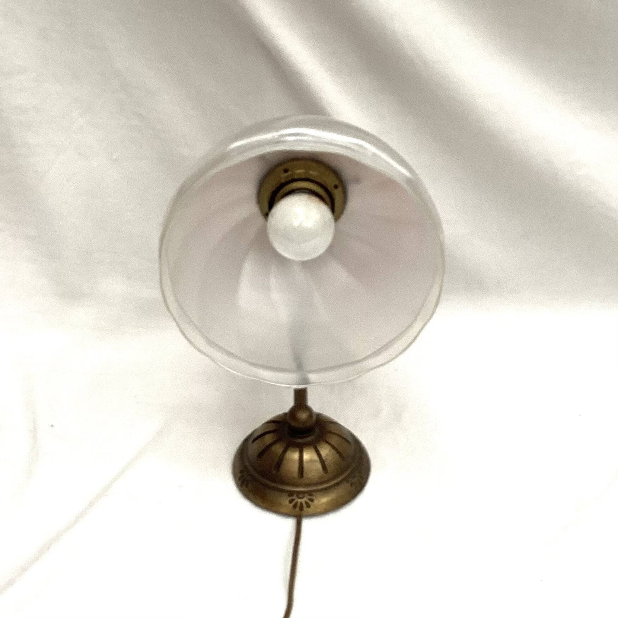 Brass wall light with a glass globe dimension: height -21cm- width -27cm-