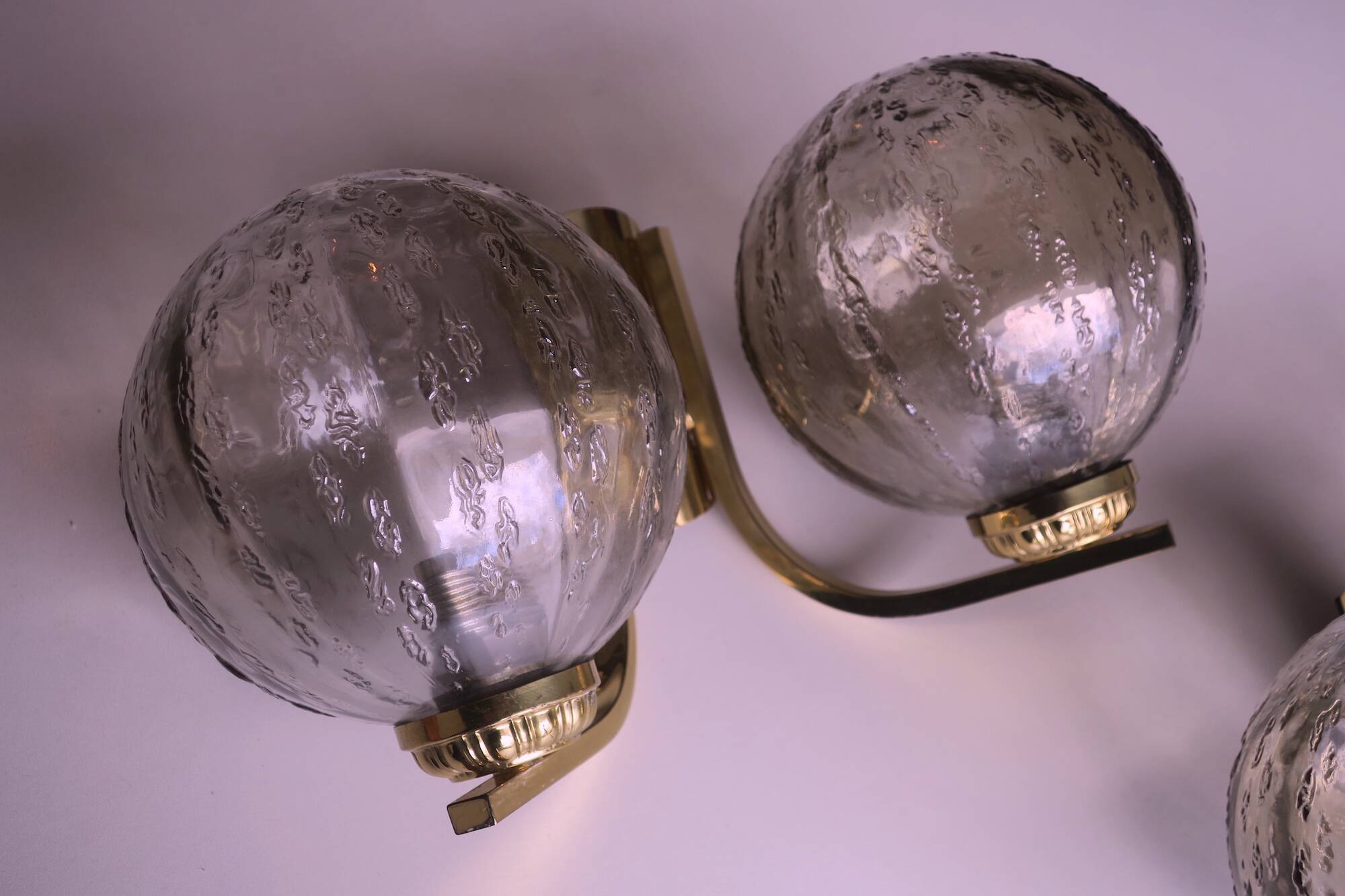 Mid century pair of brass and glass double wall lights, 1970s
