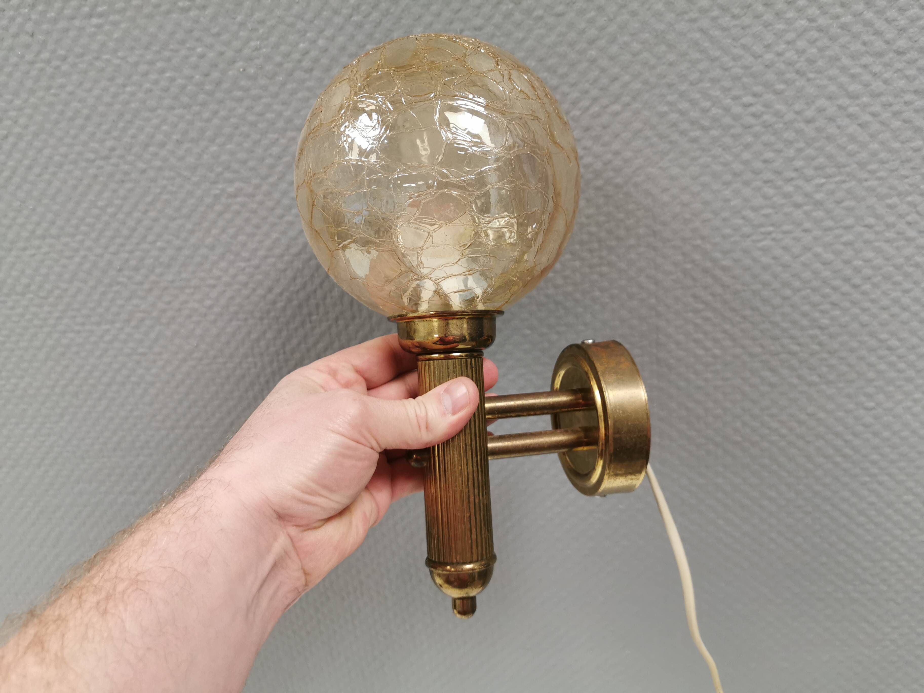 Older wall lamp in metal, brass and “cracked” glass.