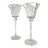 Pair of glass candlesticks on a stand