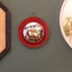 Witch's eye mirror in brass and red velvet