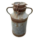 Old metal can or milk jug