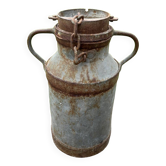 Old metal can or milk jug