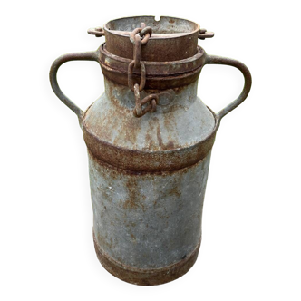 Old metal can or milk jug