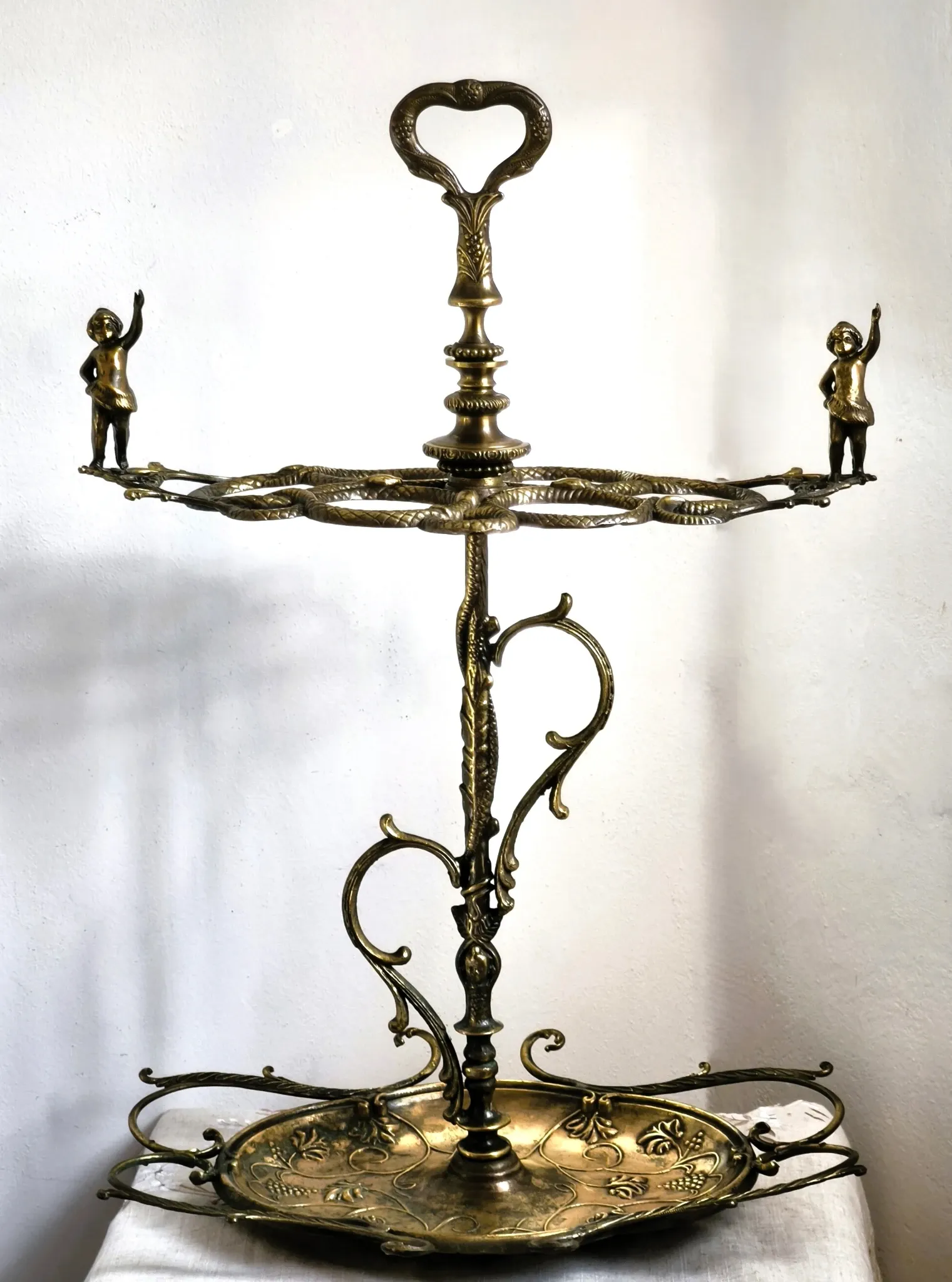 Italian brass umbrella stand, Art Nouveau style, with putti.