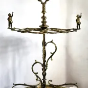 Italian brass umbrella stand, Art Nouveau style, with putti.
