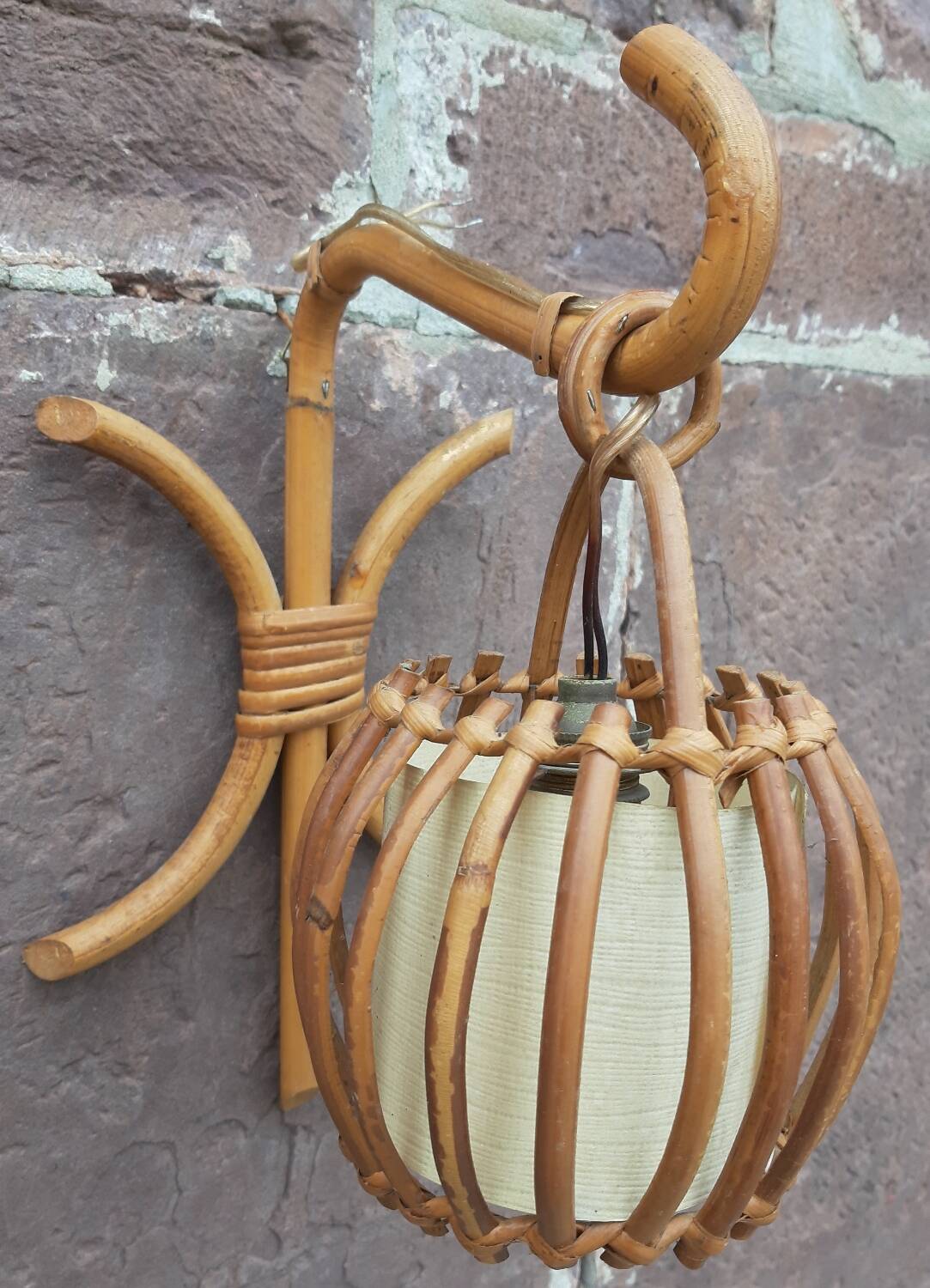 Pair of Louis Sognot rattan wall lights.