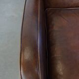 A stately, well-preserved, and comfortable sheepskin armchair