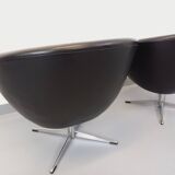 Pair of vintage Scandinavian swivel armchairs in faux leather and chrome.