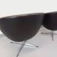 Pair of vintage Scandinavian swivel armchairs in faux leather and chrome.