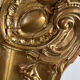 Large antique baroque mirror with angel decorations.