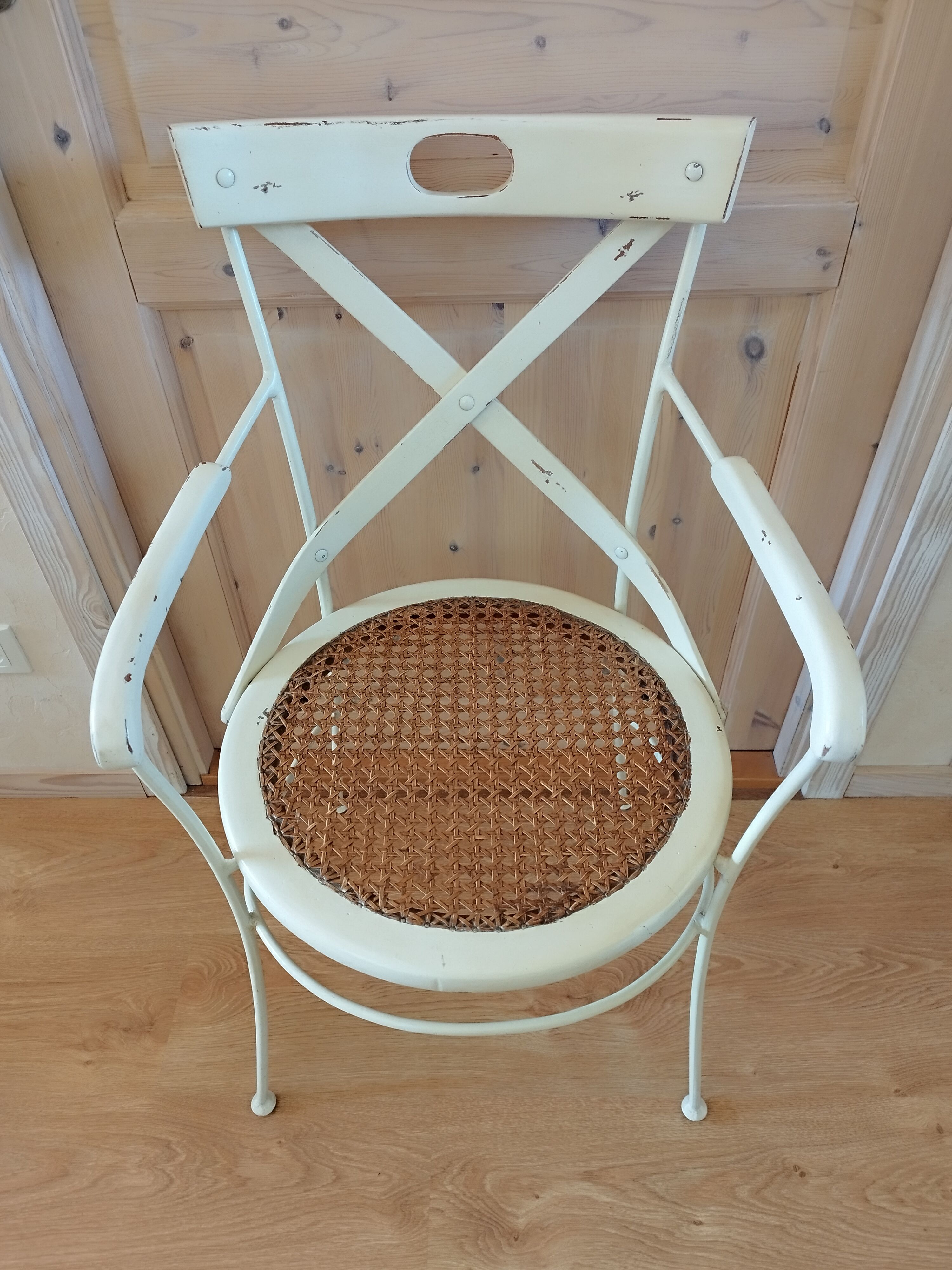 Canned chair with wooden and metal braces
