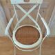 Canned chair with wooden and metal braces