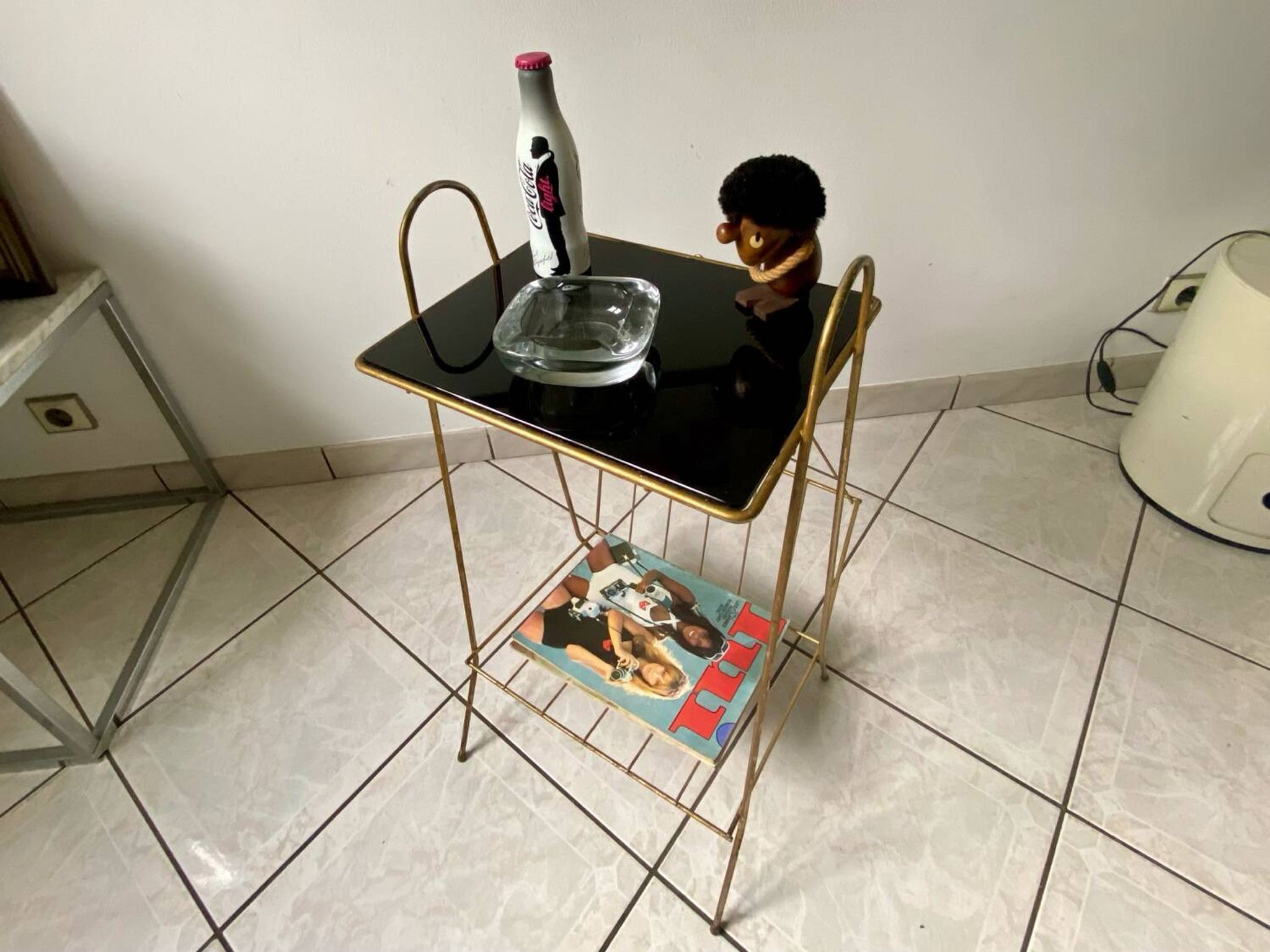 Vintage 1960s brass and smoked glass side table with magazine holder.