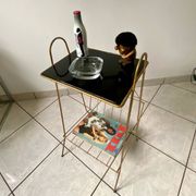 Vintage 1960s brass and smoked glass side table with magazine holder.