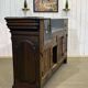 Early 20th-century oak bar counter with period zinc and tin cladding.