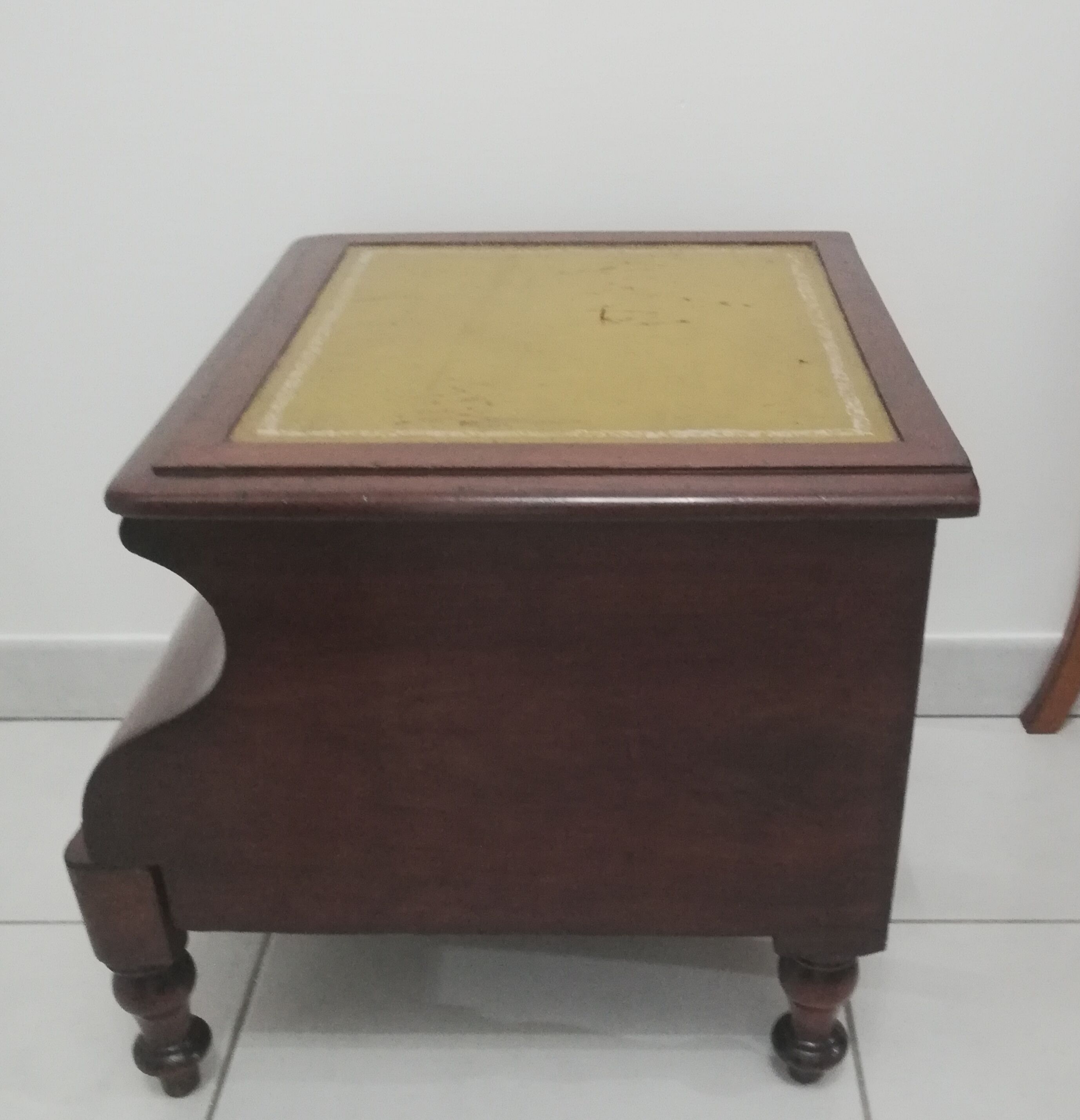 Old stepladder or English mahogany library foot walk