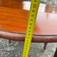 Antique round mahogany table, turned and fluted legs