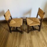 Pair of low wooden and straw armchairs
