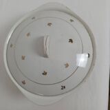 White earthenware soup tureen with a golden pattern.