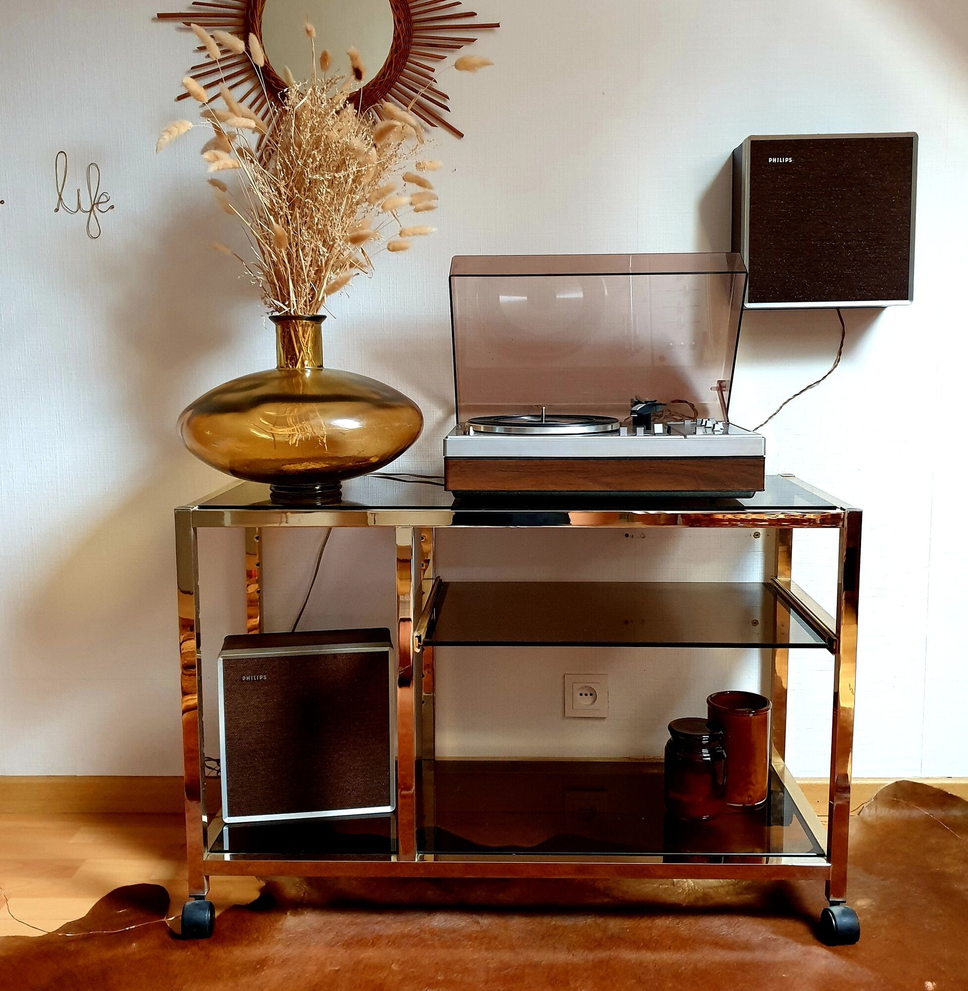 Service table with vintage brass wheels / smoked glass