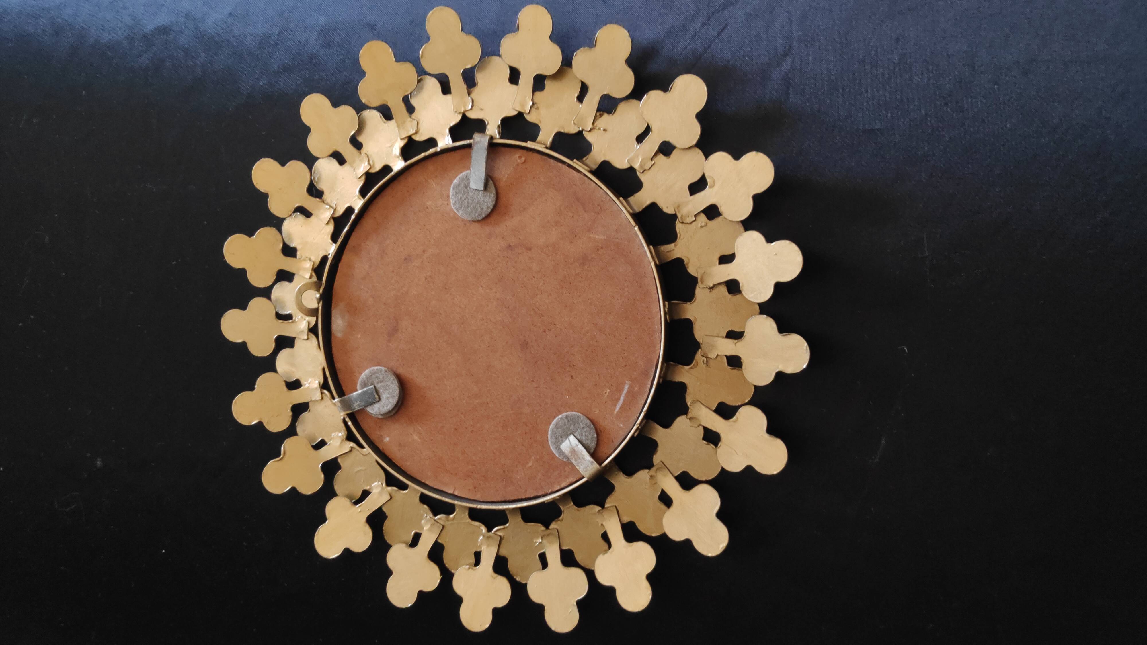 Miroir rond en métal doré