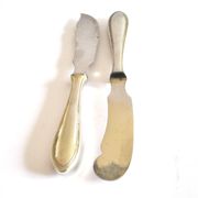 Two antique service knives in silver-plated metal, pearl frieze gowe alpacca.