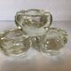 Set of three thick moulded glass candle holders.