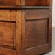Antique English oak hall bench from the early 19th century with storage space