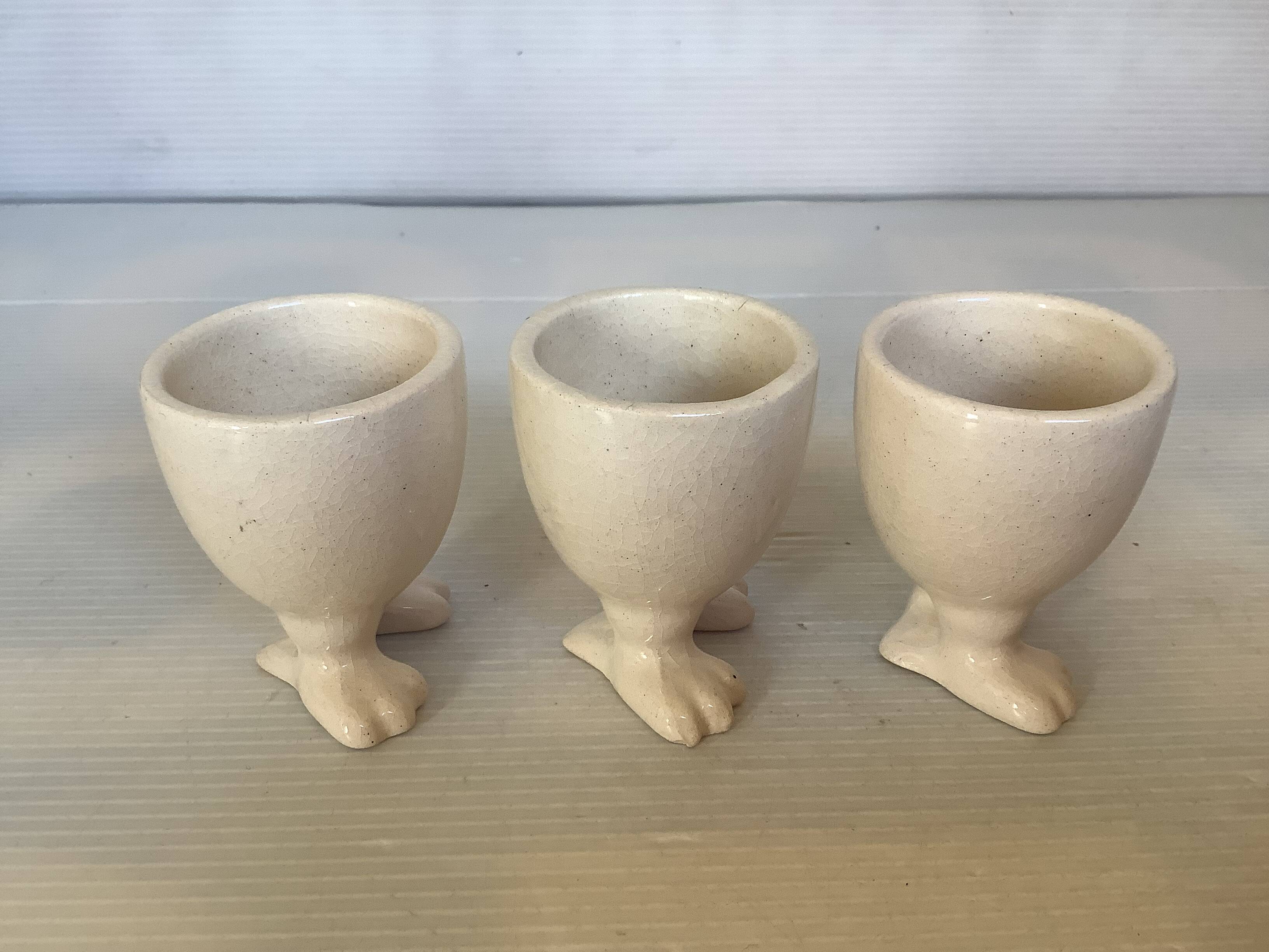 Set of cracked egg cups with feet
