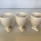 Set of cracked egg cups with feet