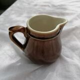 Brown ceramic teapot and milk jugs