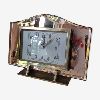 Art deco clock in pink and brass glass