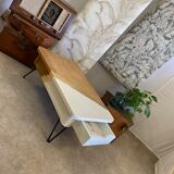 Coffee table with pin legs and gold leaf