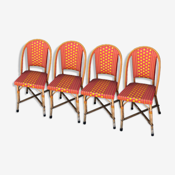 Ensemble de 4 chaises de " bistrot" en rotin naturel, signées Grock/ligne Vauzelle