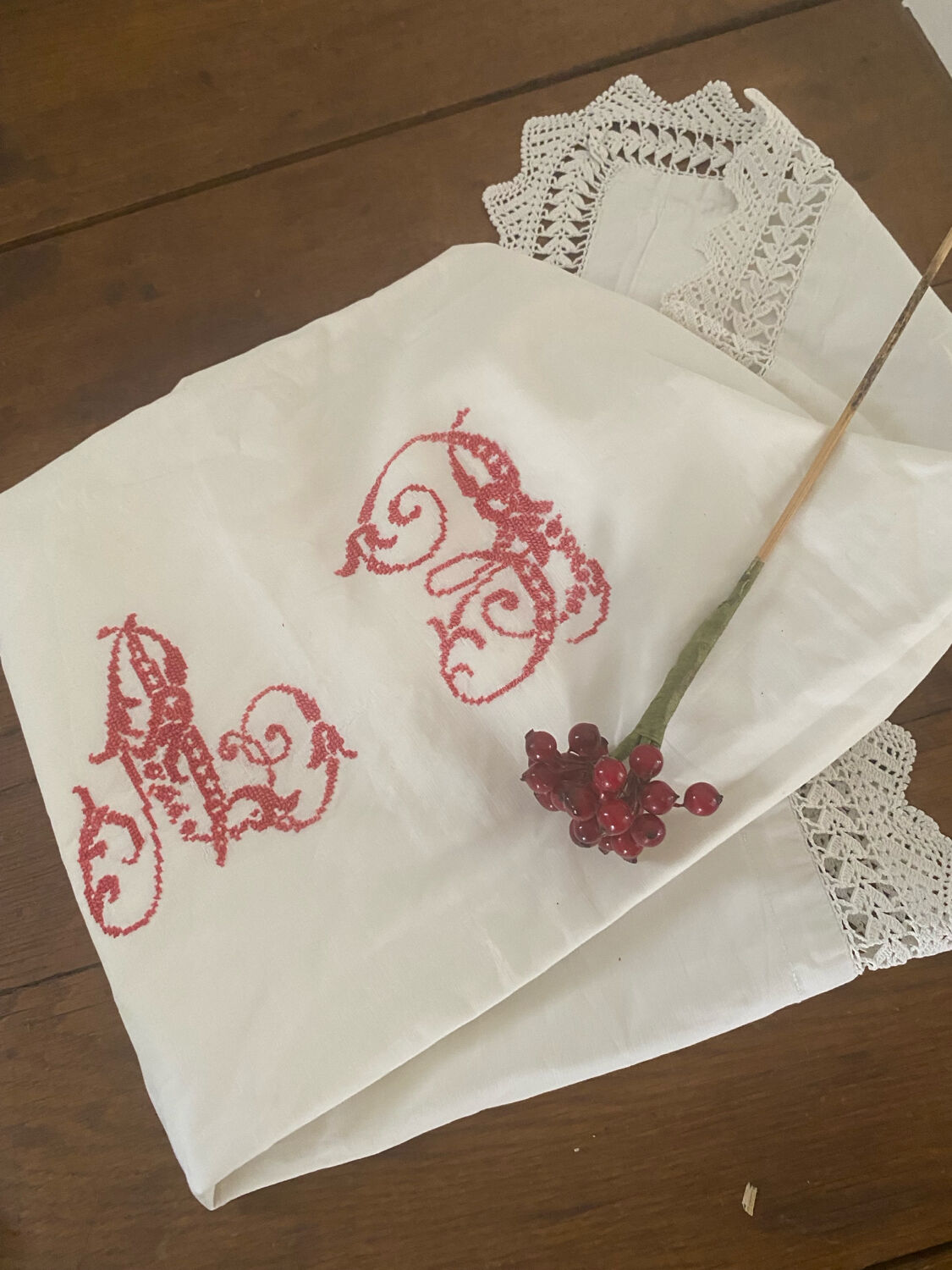Antique white cotton pillowcase with crochet and monogram.
