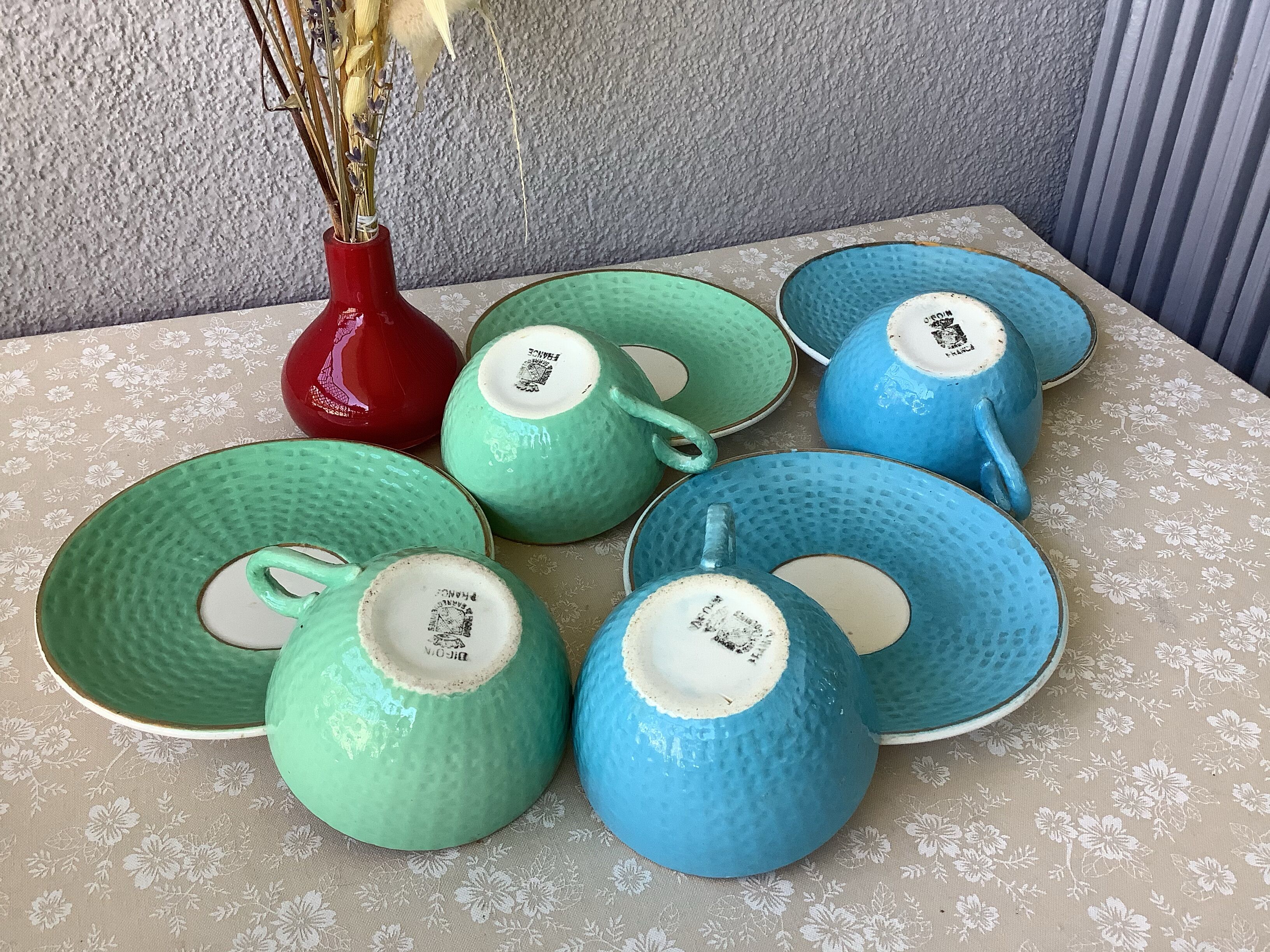 Multicolored Digoin cups looking basket weaving