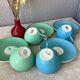 Multicolored Digoin cups looking basket weaving