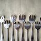 Set of 12 silver-plated oyster forks "Crossed Ribbons"