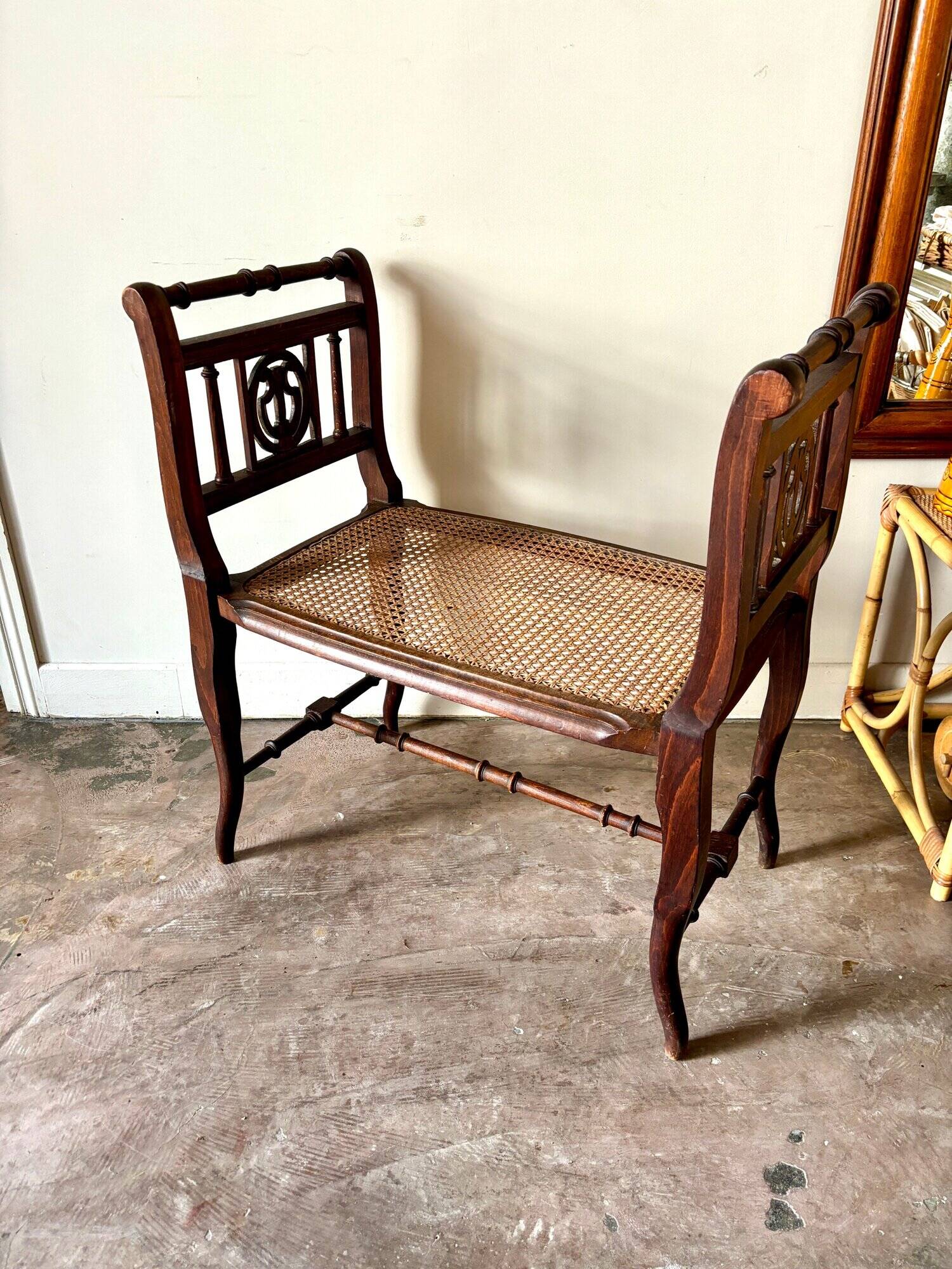 Dark wood and cane bench