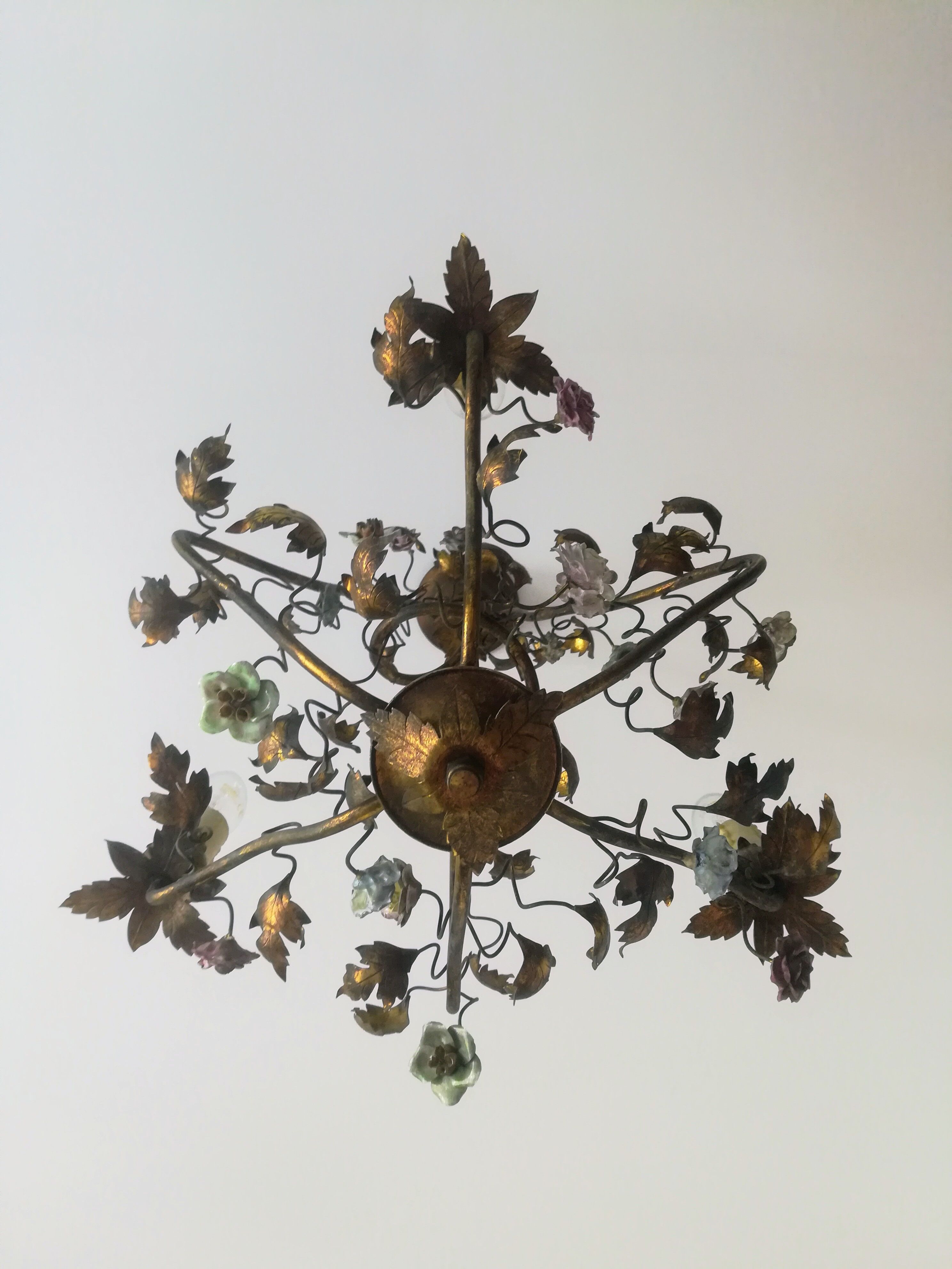 Brass chandelier and porcelain flowers