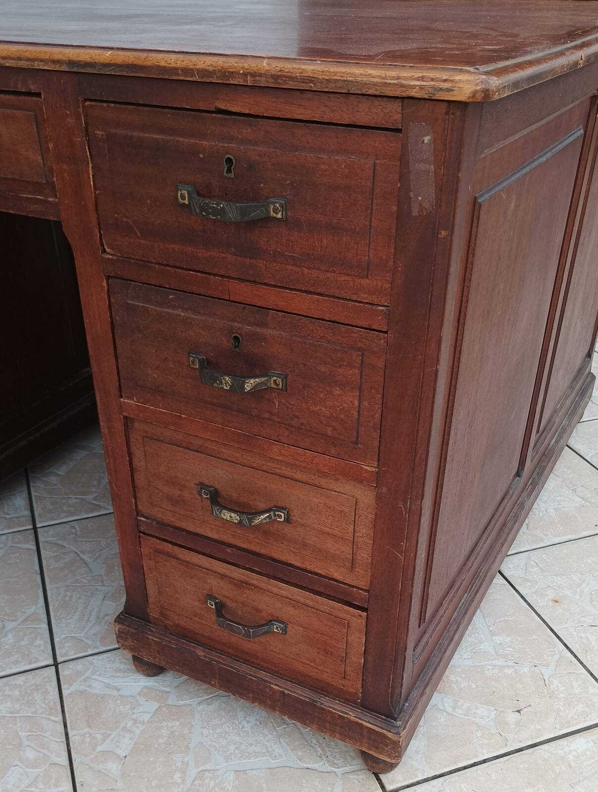 Vintage double-sided mahogany desk with 18 drawers.