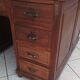 Vintage double-sided mahogany desk with 18 drawers.
