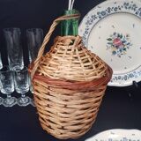 Small bottle style dame Jeanne and its wicker