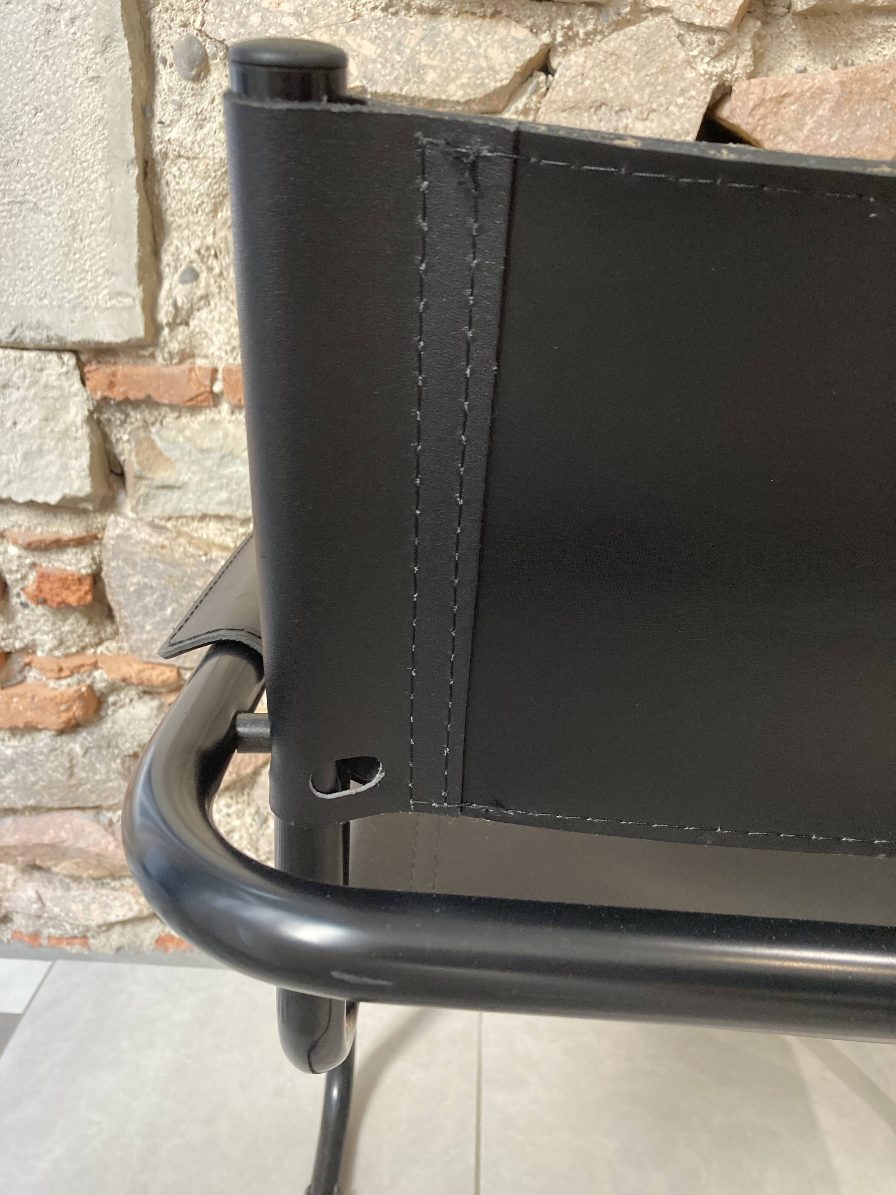 Armchair in black lacquered metal